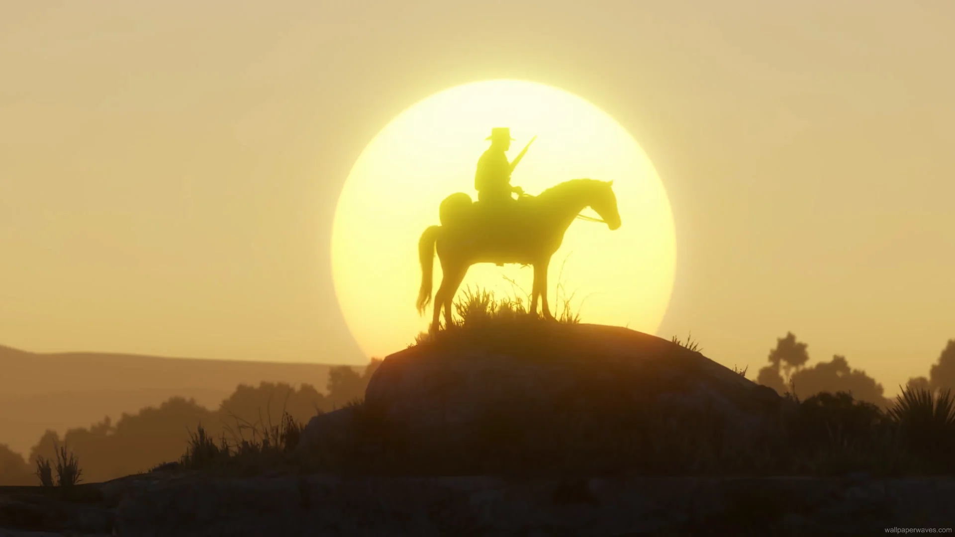Arthur Morgan on horseback during a sunset with a glowing sky and Western landscape in a cinematic Red Dead Redemption 2 wallpaper.