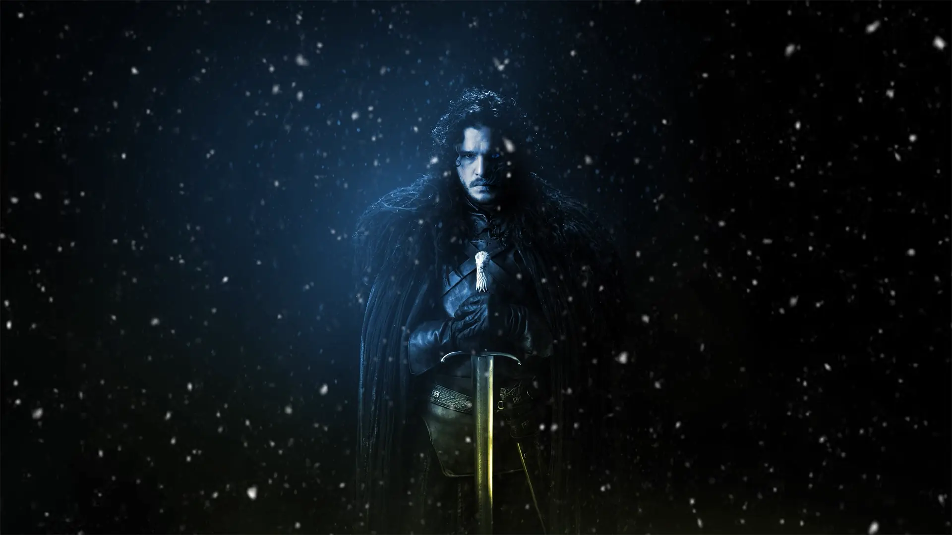 Jon Snow standing in a snowy landscape near the Wall with his sword drawn and Ghost nearby from Game of Thrones wallpaper.