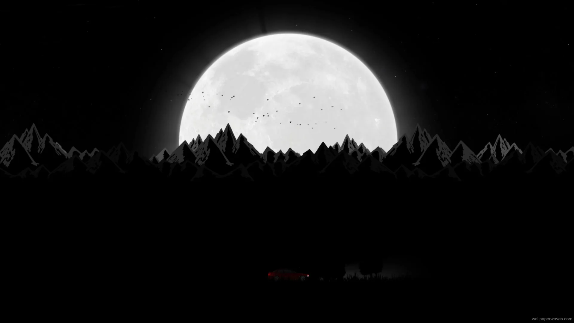 Nighttime mountain road winding through moonlit forest with mist and glowing headlights in a peaceful scenic wallpaper.