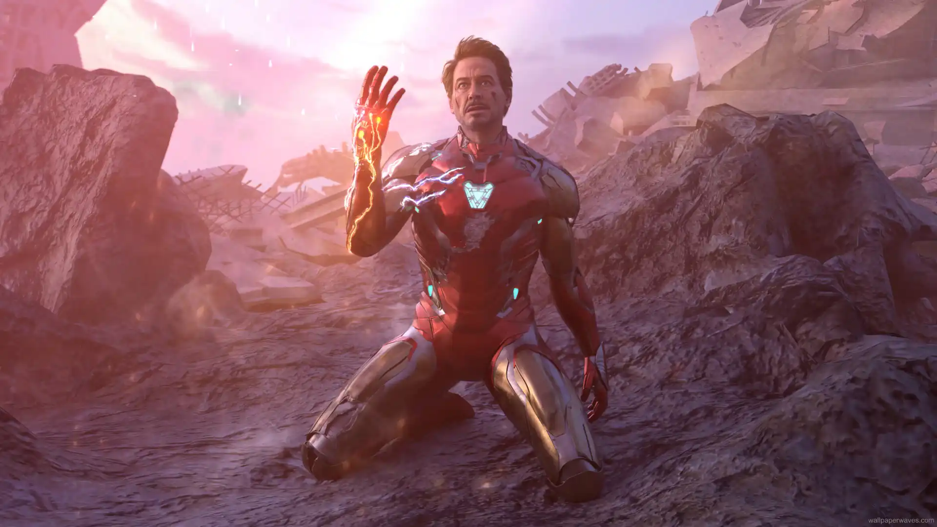 Tony Stark raising the Infinity Gauntlet in a battlefield as energy surges around him, recreating the iconic Endgame scene, Avengers live wallpaper