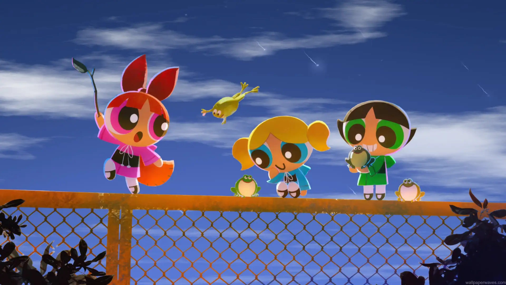 The Powerpuff Girls flying across the sky with colorful trails over Townsville in a bright cartoon-style animated scene – wallpaper.