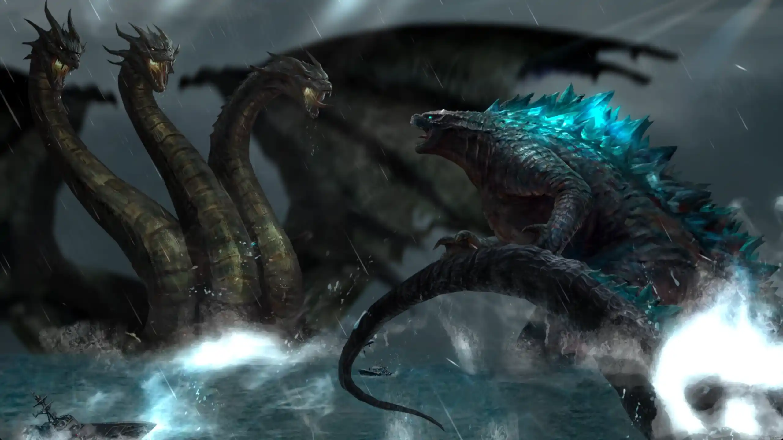 Godzilla clashing with King Ghidorah amid a stormy sky and crumbling cityscape, with atomic breath and lightning in full display – wallpaper.