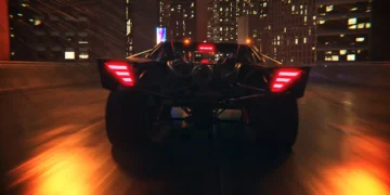Batmobile speeding through a rainy Gotham City at night with neon reflections, skyscrapers, and dramatic lighting – wallpaper.