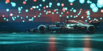 Mercedes-AMG Formula 1 car racing at night with glowing lights and motion blur, high-performance racing vehicle live wallpaper