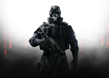 Tactical soldier from Rainbow Six Siege standing in smoke with glowing visor and heavy armor in a dark battlefield – live wallpaper.