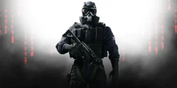 Tactical soldier from Rainbow Six Siege standing in smoke with glowing visor and heavy armor in a dark battlefield – live wallpaper.