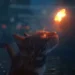 Curious cat staring at a glowing butterfly in a softly lit night scene with sparkles floating in the background in a live wallpaper