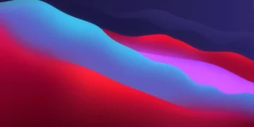 Abstract macOS Big Sur inspired gradient with flowing blue, pink, and orange colors blending smoothly in a minimalistic live wallpaper