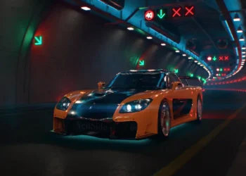 Mazda RX-7 Veilside from Tokyo Drift with orange and black body kit under neon city lights in a JDM street racing live wallpaper