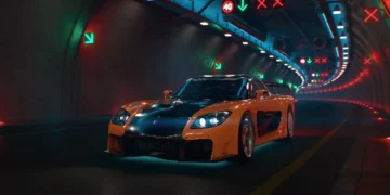 Mazda RX-7 Veilside from Tokyo Drift with orange and black body kit under neon city lights in a JDM street racing live wallpaper