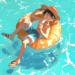 Luffy relaxing poolside with sunglasses and popsicle under tropical sun, One Piece summer anime live wallpaper