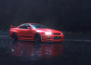 Red Nissan Skyline R34 driving on rain-soaked city streets at night with glowing neon reflections in a cinematic live wallpaper