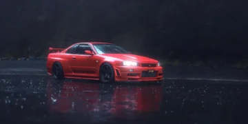 Red Nissan Skyline R34 driving on rain-soaked city streets at night with glowing neon reflections in a cinematic live wallpaper
