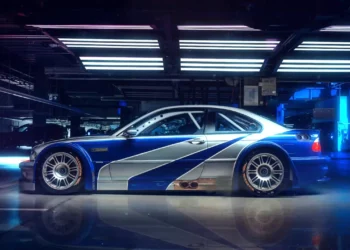 BMW M3 GTR in blue and silver widebody design glowing under city lights inspired by Need for Speed Most Wanted live wallpaper