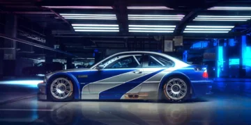 BMW M3 GTR in blue and silver widebody design glowing under city lights inspired by Need for Speed Most Wanted live wallpaper