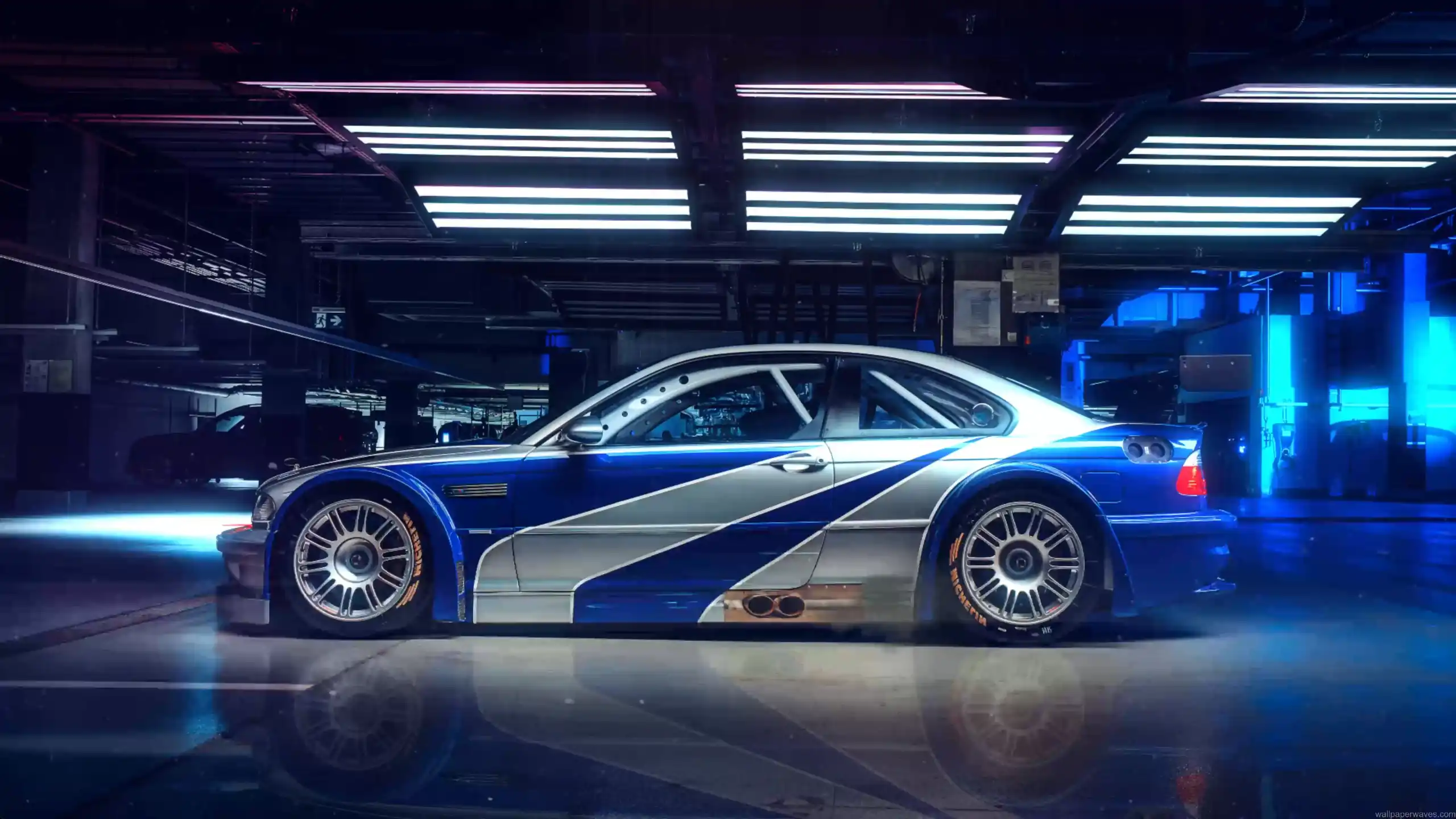 BMW M3 GTR in blue and silver widebody design glowing under city lights inspired by Need for Speed Most Wanted live wallpaper