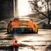 Yellow Toyota Supra parked in cinematic city setting with glowing tail lights reflecting on rain-soaked street in a live wallpaper