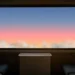 Calm sunset view from a train window with clouds and twilight sky in warm colors live wallpaper