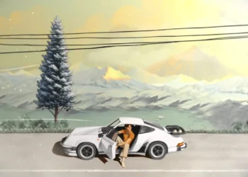 White Porsche 911 parked on peaceful mountain roadside with driver stepping out, snowy peaks and lake in background under golden sunset sky in calm anime landscape wallpaper