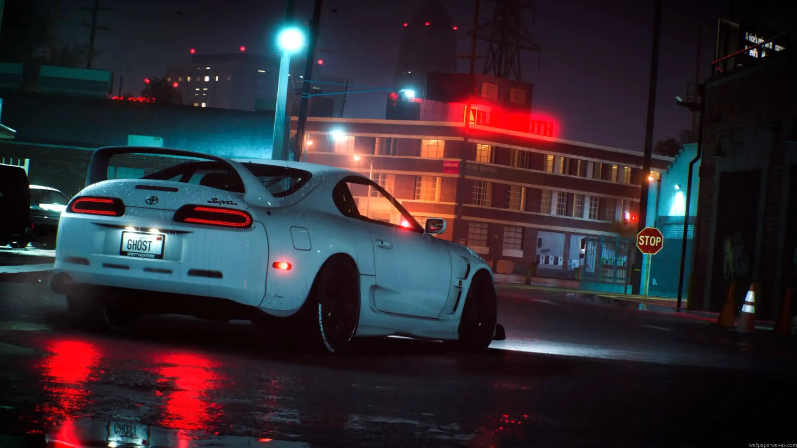 Toyota Supra MK4 neon street drift with wet road reflections city lights and nighttime urban scene car wallpaper