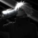 Gojo Drinking Monster JJK Live Wallpaper 10 Satoru Gojo drinking a Monster energy drink in dramatic dark lighting with glowing blue eye and minimalist anime aesthetic wallpaper