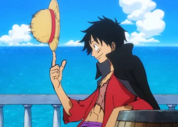 Monkey D. Luffy spinning his iconic Straw Hat aboard a ship with the blue ocean behind him in Luffy Straw Hat Spin Live Wallpaper.