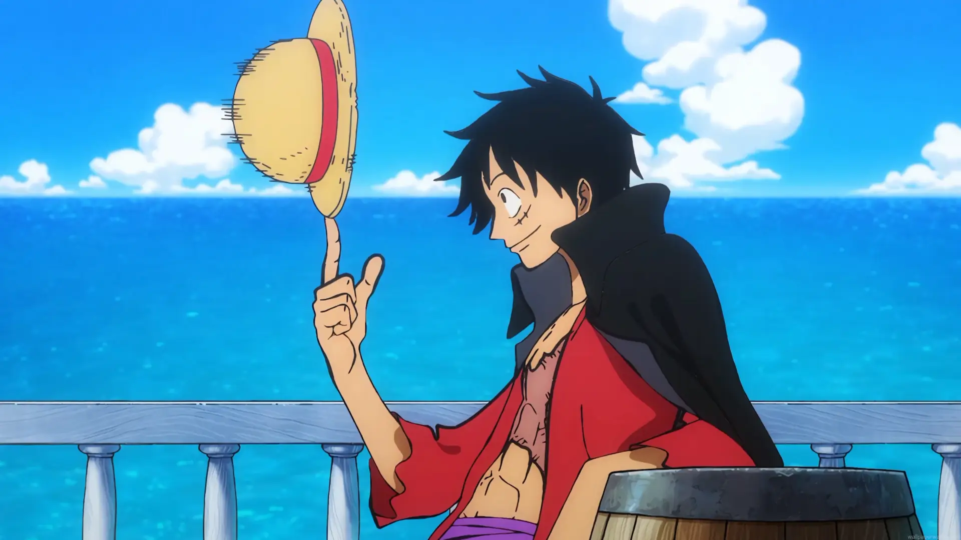 Monkey D. Luffy spinning his iconic Straw Hat aboard a ship with the blue ocean behind him in Luffy Straw Hat Spin Live Wallpaper.