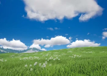 Peaceful Grassland Under Blue Sky Live Wallpaper 4 Vast green grassland with rolling hills, wildflowers, fluffy white clouds, and a bright blue summer sky creating a peaceful natural landscape wallpaper