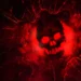 Gears of War Red Skull Emblem Live Wallpaper 10 Glowing red Crimson Omen skull emblem breaking through cracked stone in Gears of War live wallpaper.