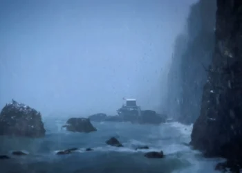 Stormy coastal cliffs with crashing waves, heavy rain, and a lone cabin overlooking the ocean live wallpaper.