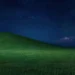 Windows XP Bliss hill under a star-filled night sky with peaceful green fields and nostalgic scenery live wallpaper.