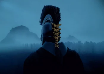 Agamemnon The Odyssey Live Wallpaper 1 Agamemnon wearing an ancient Greek warrior helmet overlooking a misty battlefield in The Odyssey live wallpaper.