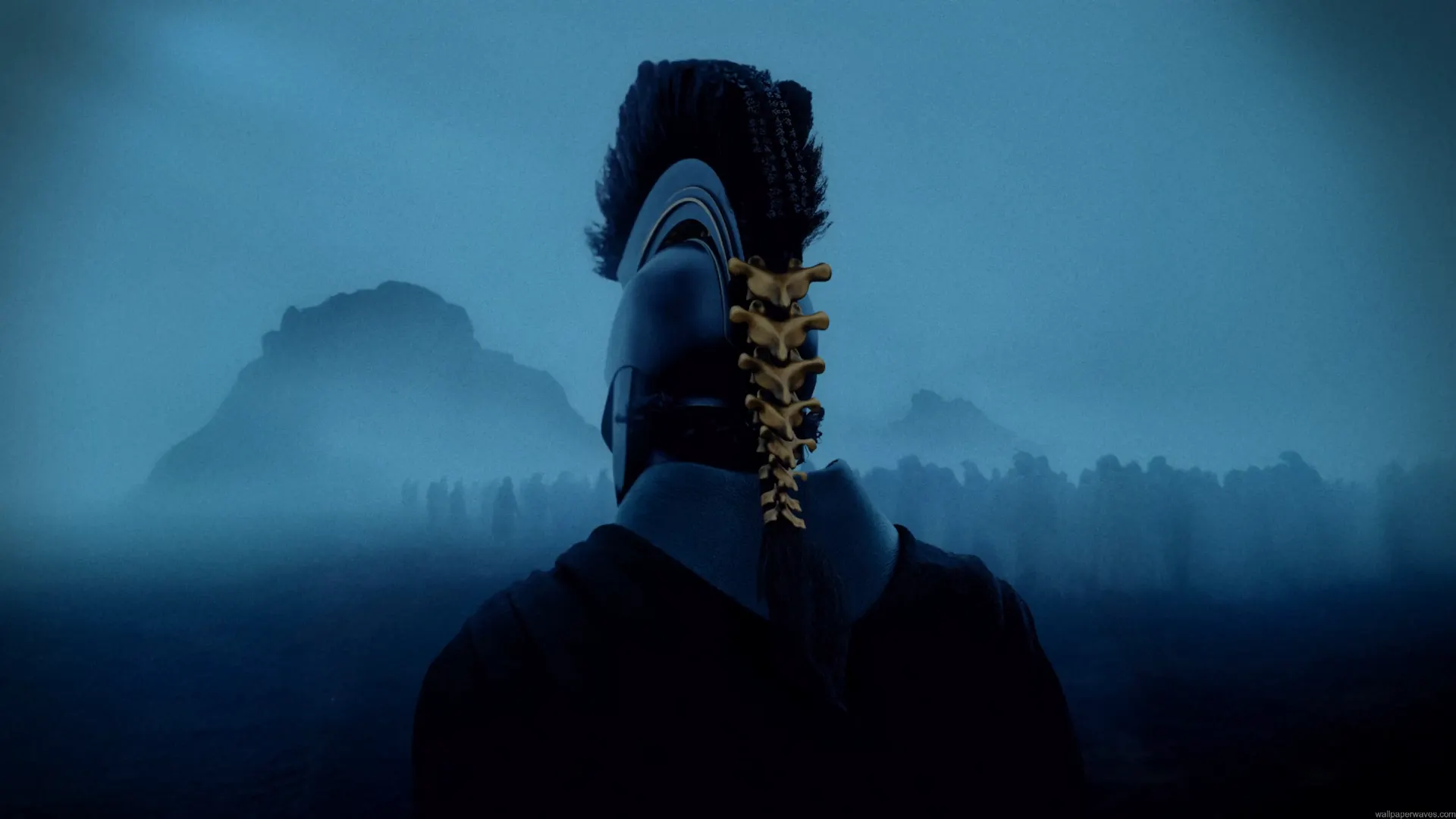 Agamemnon wearing an ancient Greek warrior helmet overlooking a misty battlefield in The Odyssey live wallpaper.