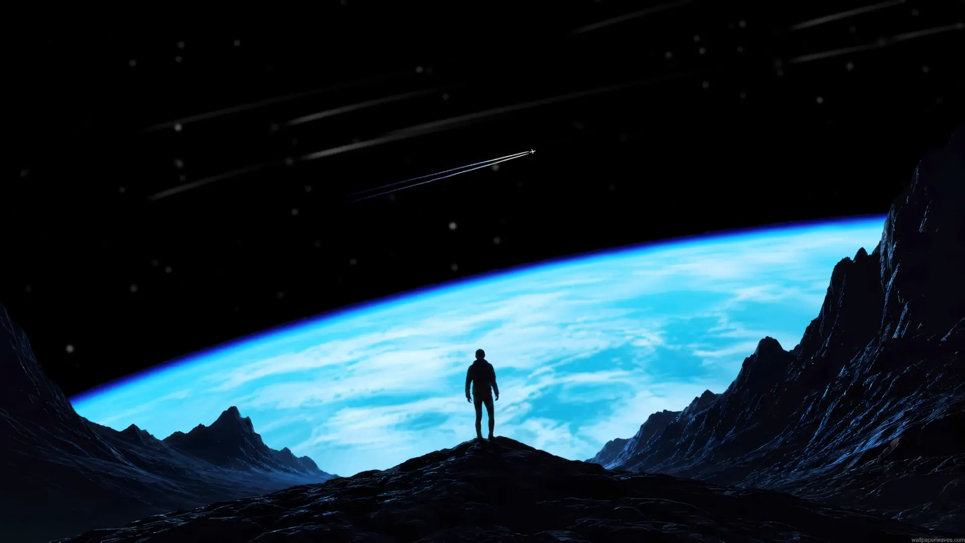 Lone explorer standing on an alien planet overlooking a massive glowing blue world and star-filled space wallpaper.