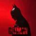 The Batman Red Poster Live Wallpaper 10 The Batman standing in profile against a dramatic red background with falling rain cinematic live wallpaper.
