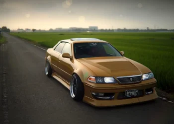 Toyota Mark II JZX100 JDM Live Wallpaper 1 Toyota Mark II JZX100 lowered JDM sedan parked on a countryside road during golden hour live wallpaper.