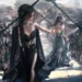 Two elegant fantasy princesses in black and silver-blue royal gowns walking between rows of armored royal guards in a medieval kingdom with soft sunlight in a 4K live wallpaper.