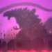 Godzilla Ultima towering over a destroyed city with massive spiked scales, a giant curved tail, flying debris, and a glowing purple-pink apocalyptic sky in a sci-fi live wallpaper.